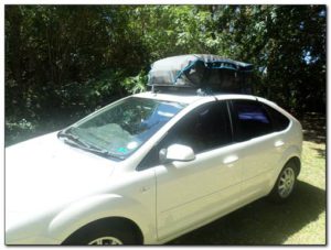 gear roof rack car racking system paddle kayak fishing rod distance front angle view